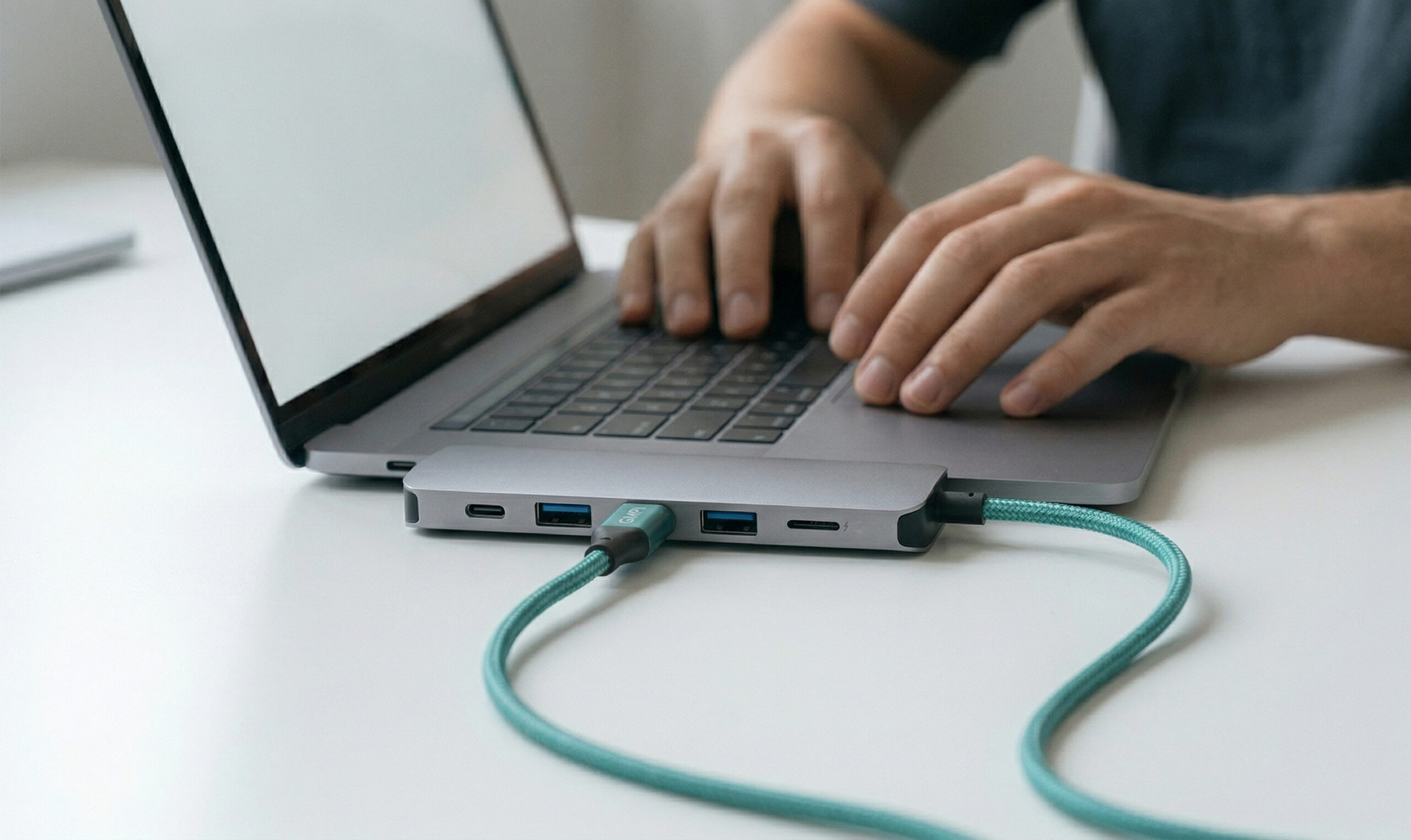 Laptop charging on desk
